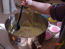 Hunter mixing the batter.