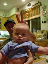 Dave gives Hunter bunny ears.