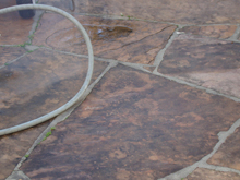 Very dirty flagstone before.