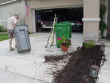 Dave hauls away the old shrubs.